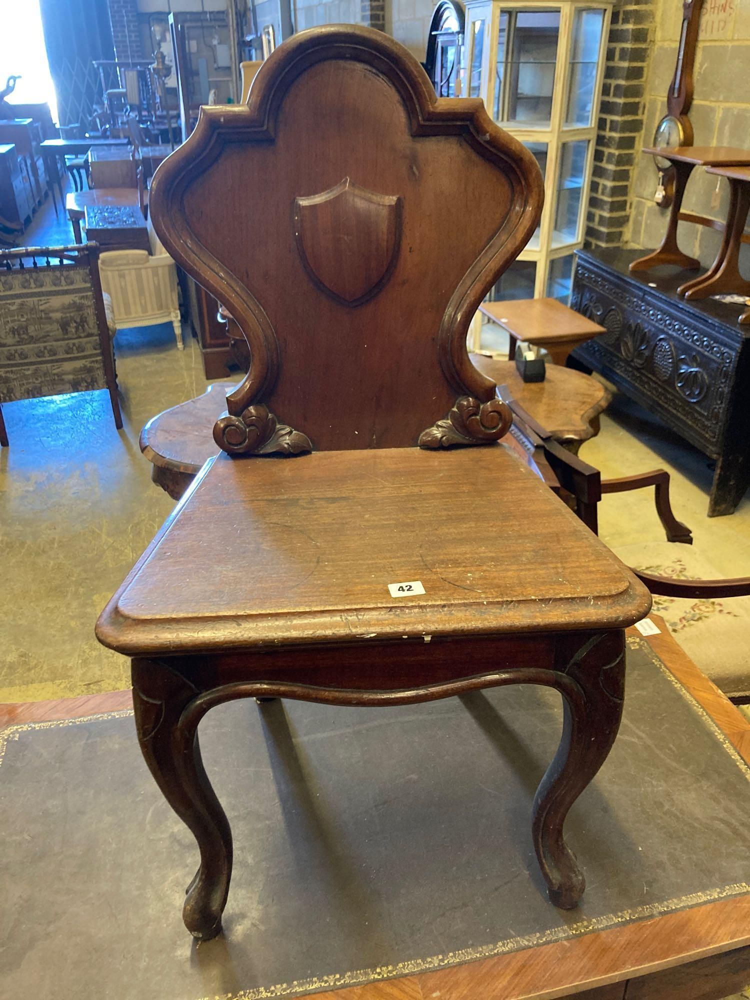 A Louis XVI style kingwood writing table, with central drawer, width 114cm and a Victorian mahogany hall chair